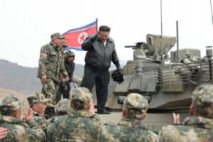 Kim Jong Un Drives New Military Tank In Mock Battle